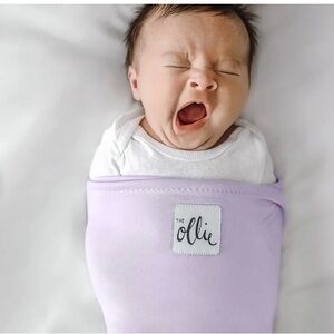 bundle of two baby swaddles by The Ollie in blue and lavender!